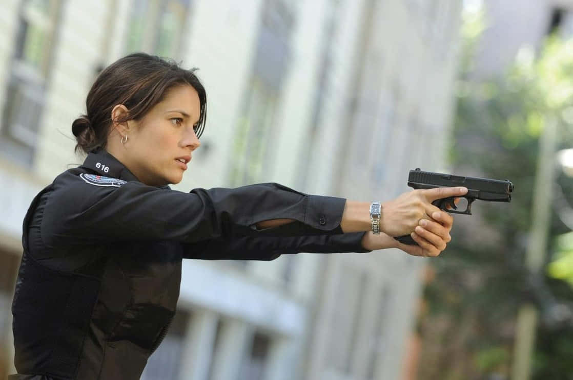 Action_ Scene_ Female_ Agent_ With_ Gun Wallpaper