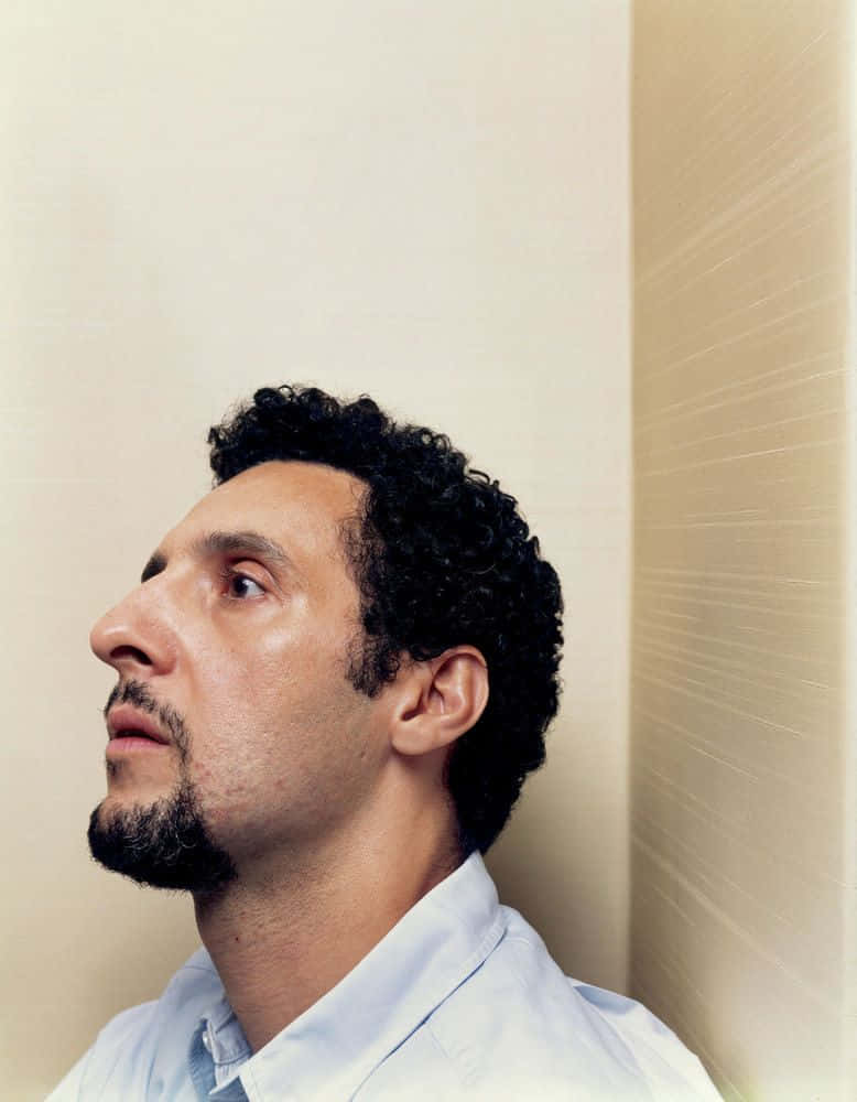 Actor John Turturro Looking Confidently Into The Future. Wallpaper