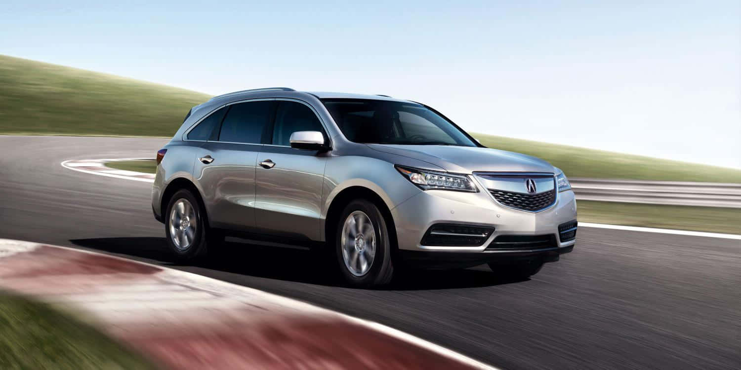 Acura Mdx Cruising On A Scenic Road Wallpaper