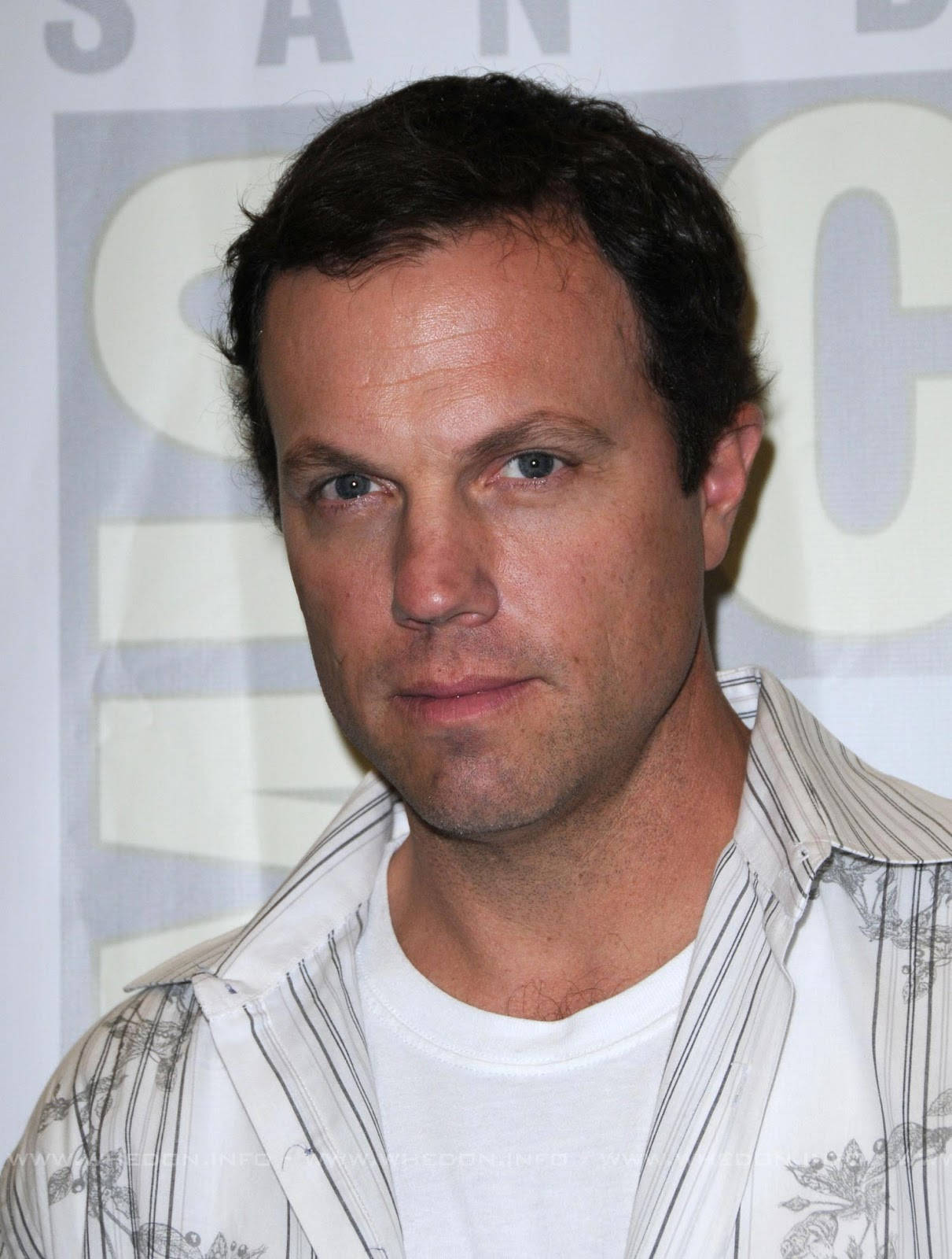 Adam Baldwin Looking Elegant In White Suit Wallpaper