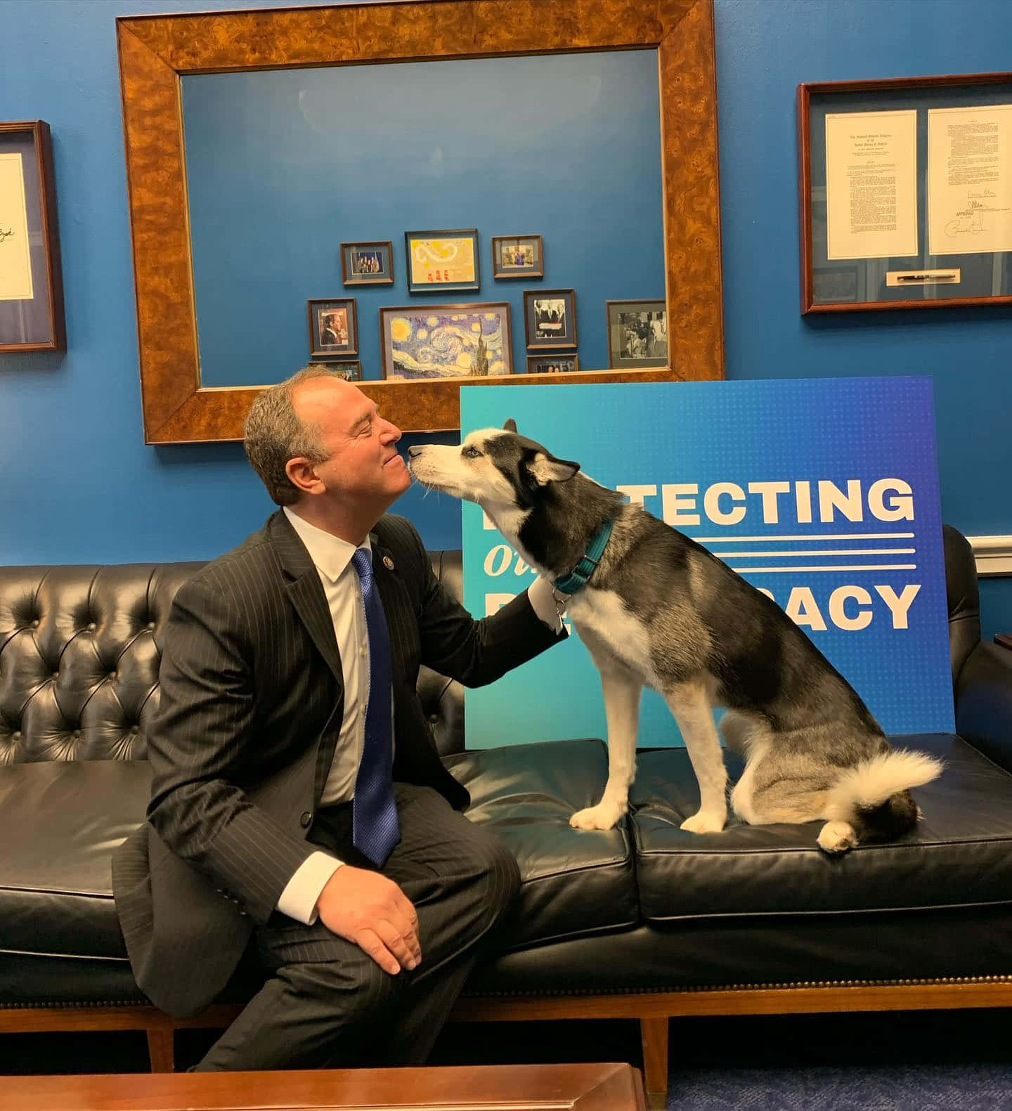 Adam Schiff Receiving A Dog's Smooch Wallpaper