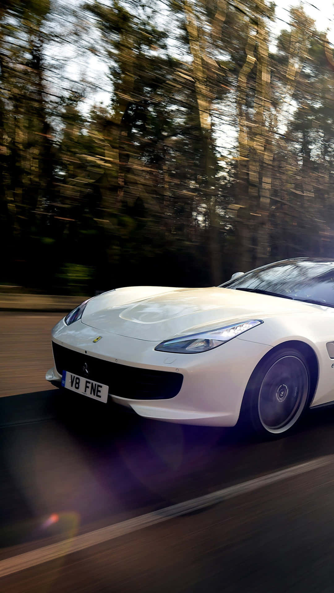 Add A Bit Of Luxury To Your Life With A White Ferrari Iphone. Wallpaper