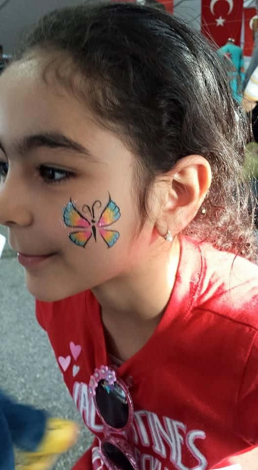 Add A Dash Of Color To Your Face With Butterfly Face Painting Wallpaper