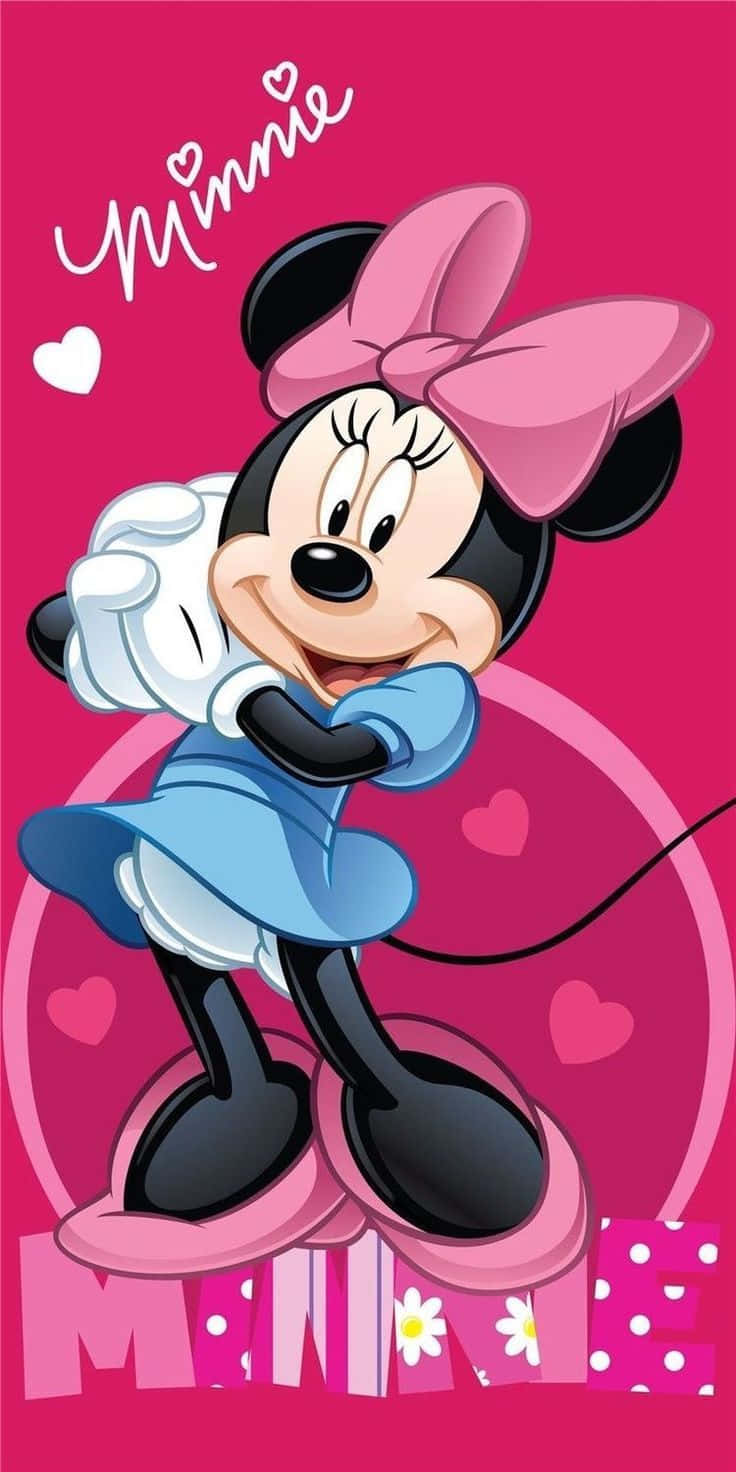 Adorable Minnie Mouse Looking To Capture Your Heart In Her Lovely Pink Dress. Wallpaper