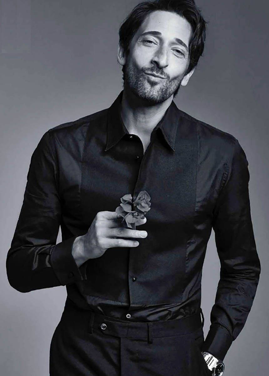 Adrien Brody Holding A Flower Wallpaper