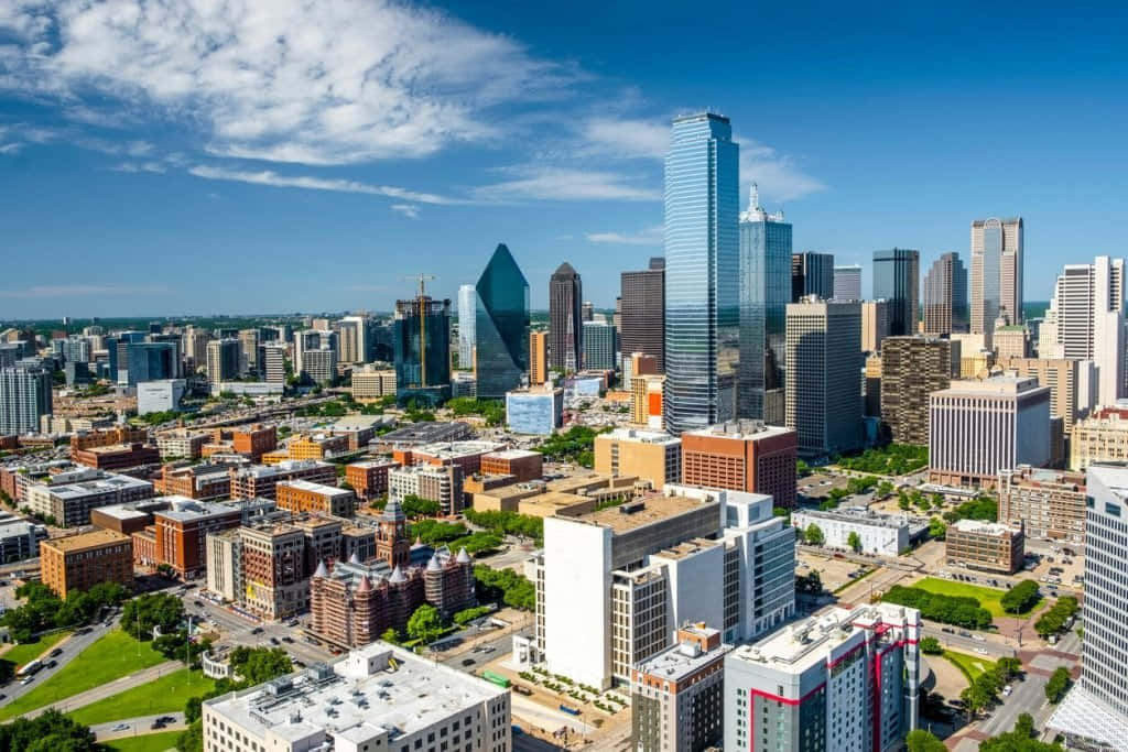 Aerial View Of The Dallas City Skyline At Sunset Wallpaper