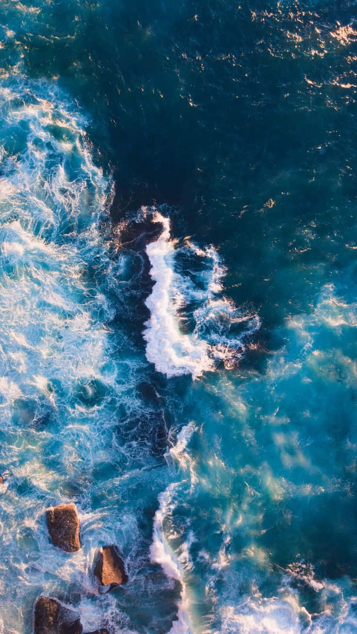 Aerial View4 K Ultra H D Ocean Waves Crashing Rocks Wallpaper