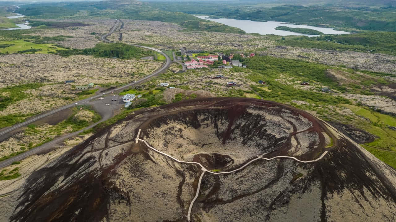 Aerial Viewof Volcanic Craterand Landscape Wallpaper