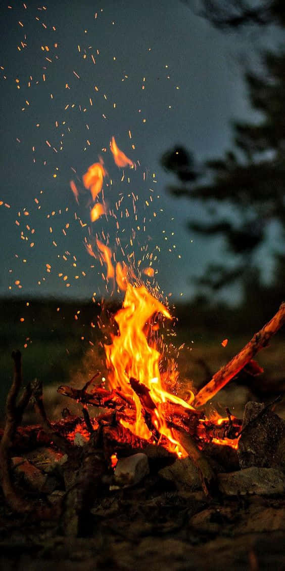 Aesthetic Bonfire Embers Floating Above Wallpaper