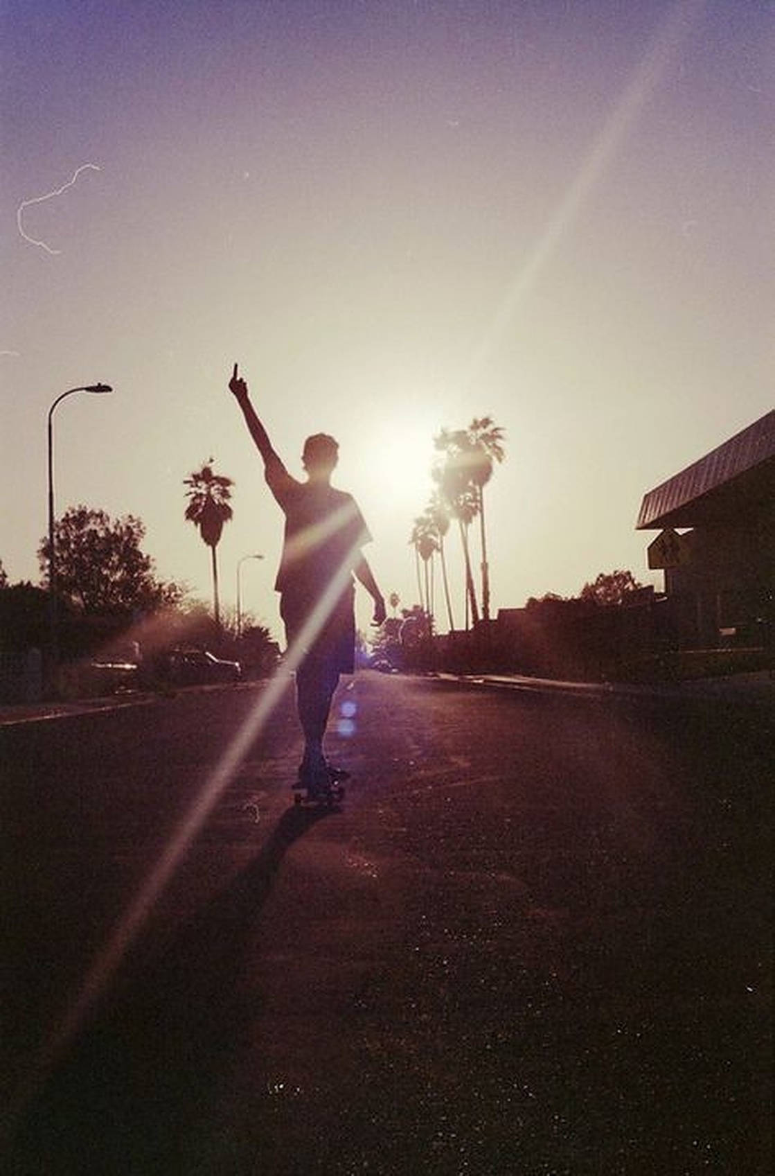 Aesthetic Skater Boy During The Day Wallpaper