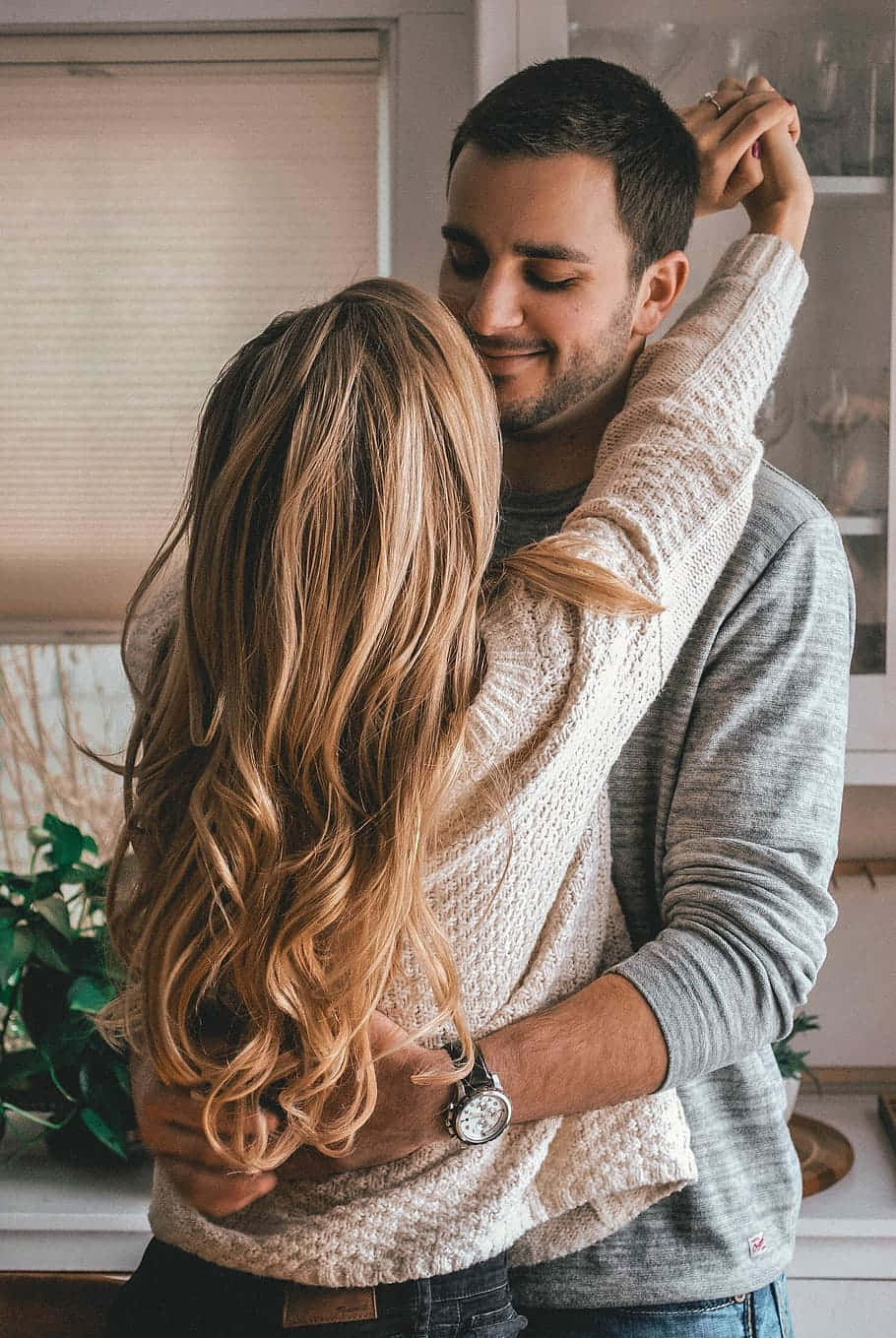 Affectionate Couple Hugging Wallpaper