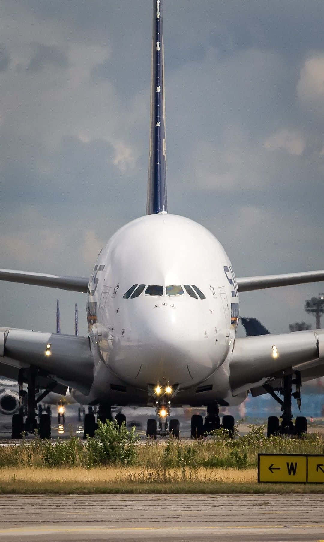 Airbus A380 Frontal View On Runway Wallpaper