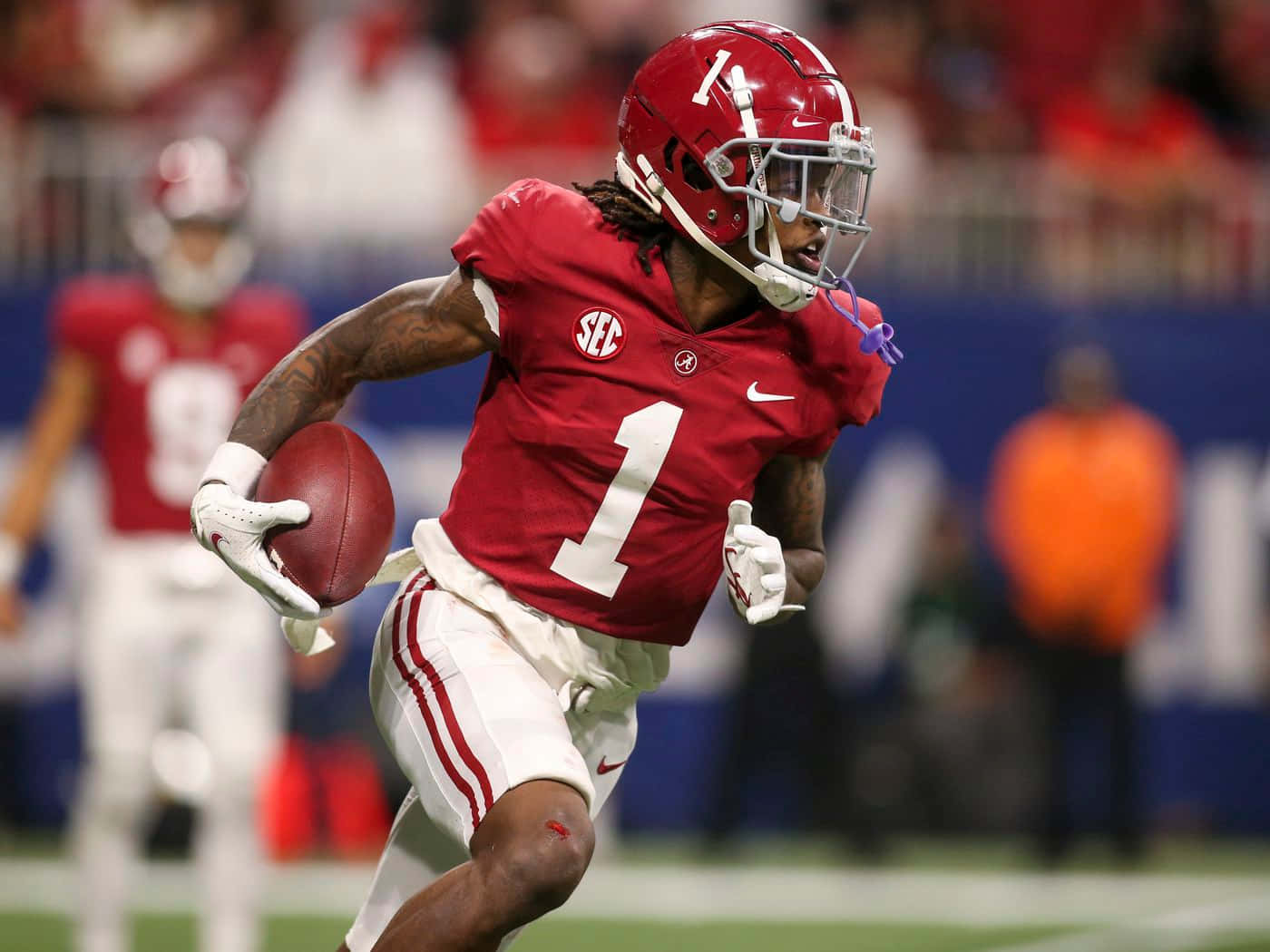 Alabama Football Player Running With Ball Wallpaper