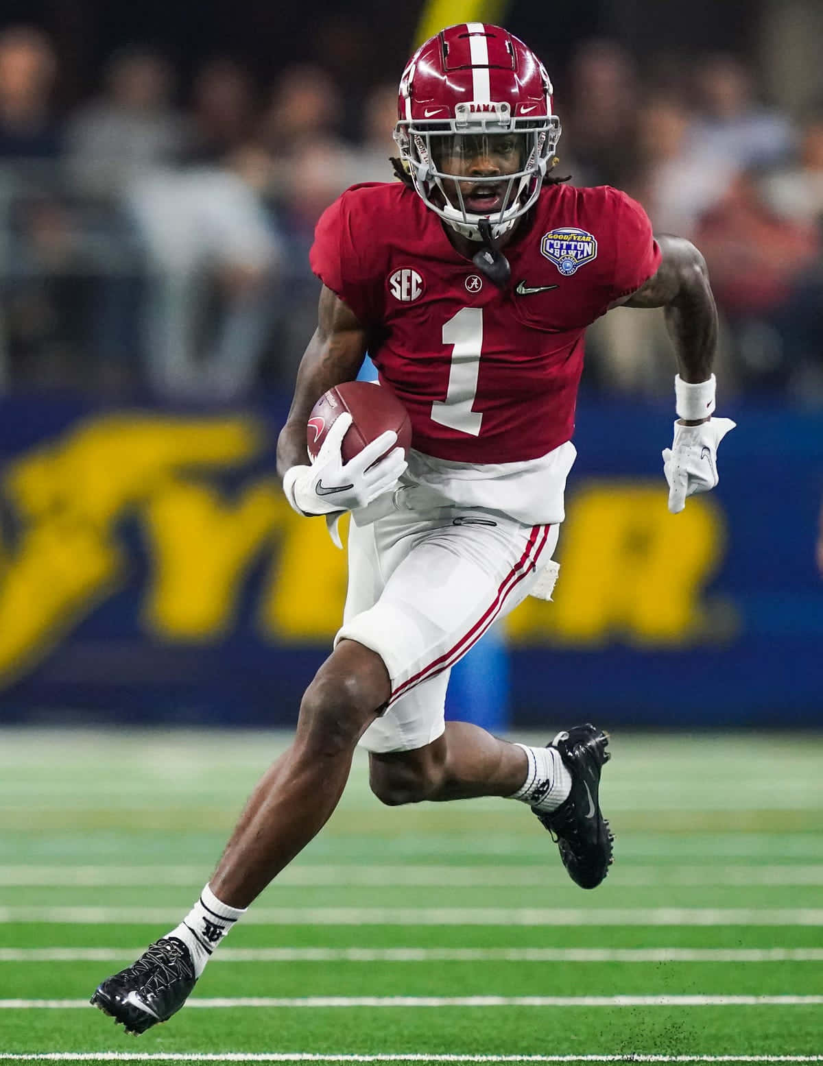 Alabama Football Player Running With Ball Wallpaper