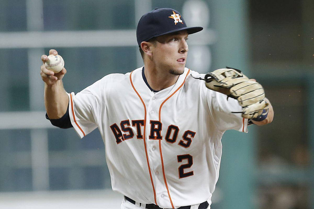 Alex Bregman Holding Up A Baseball And Glove Wallpaper