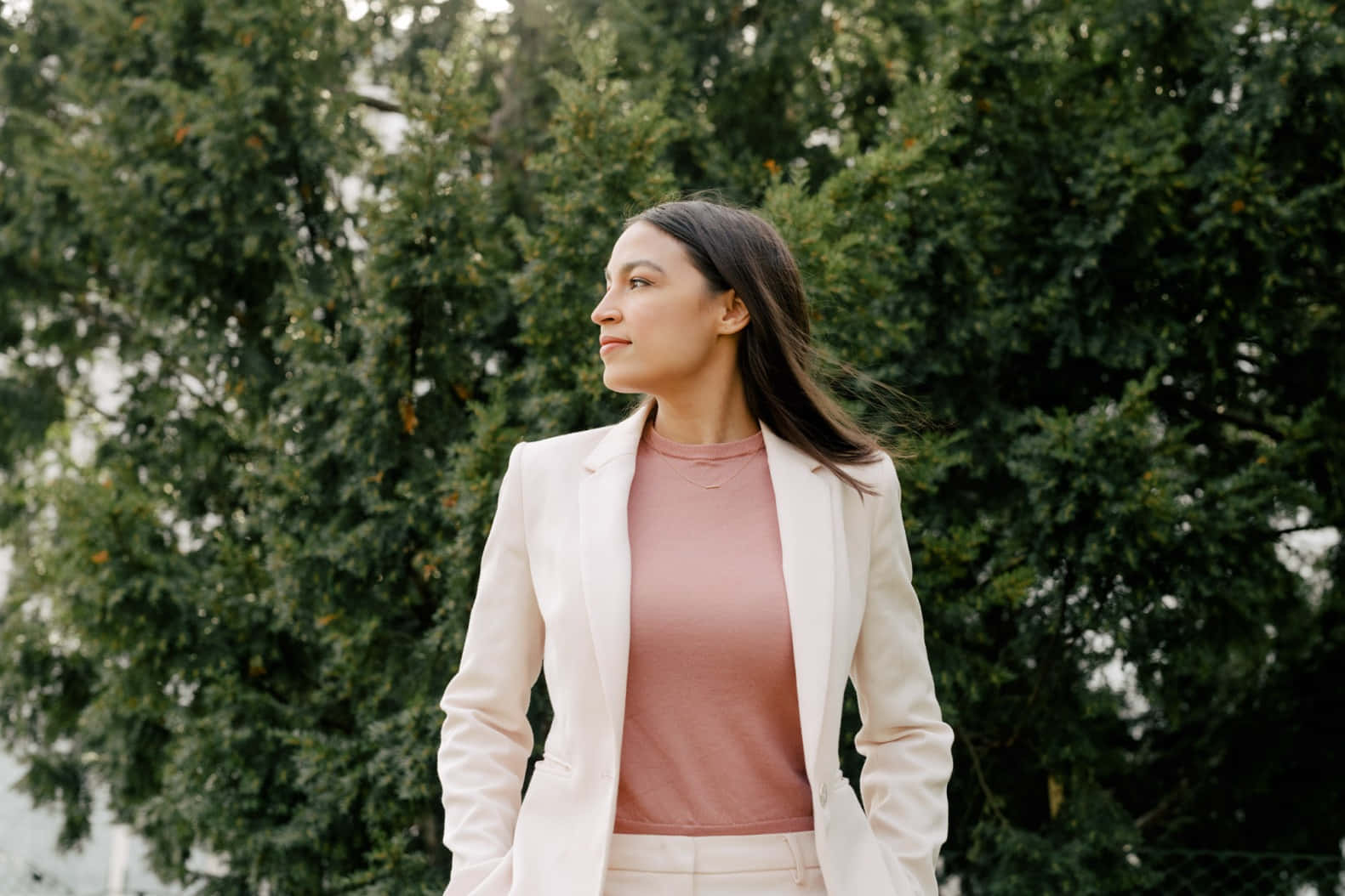 Alexandria Ocasio-cortez Beneath A Tree Wallpaper