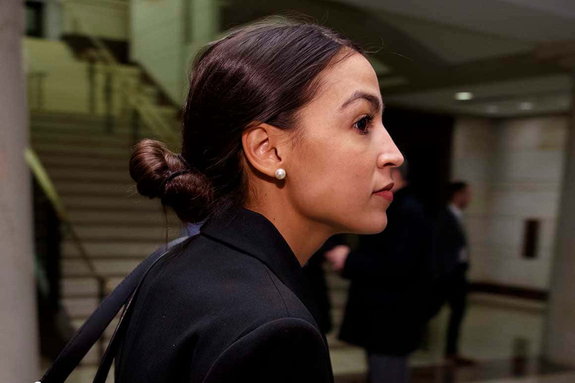 Alexandria Ocasio-cortez Gazing Into The Distance Wallpaper