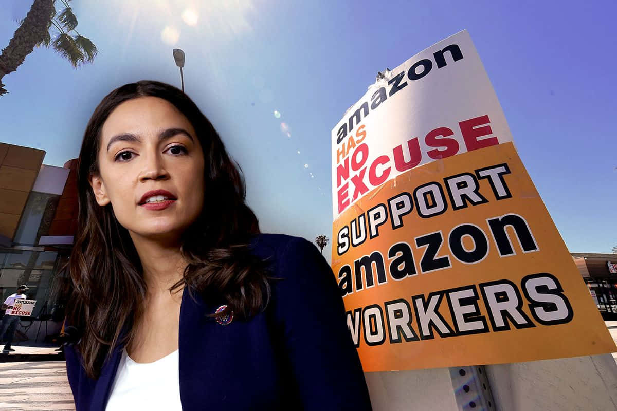 Alexandria Ocasio-cortez With Signs Protesting Amazon Wallpaper