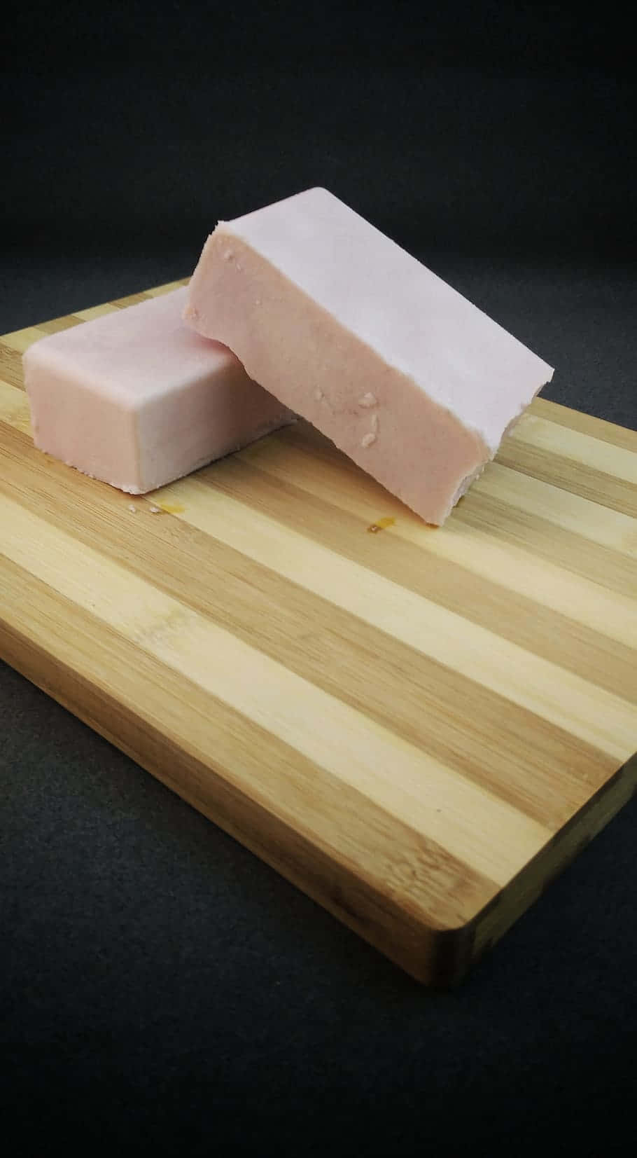 All-natural Soap Bars On A Wooden Chopping Board Wallpaper