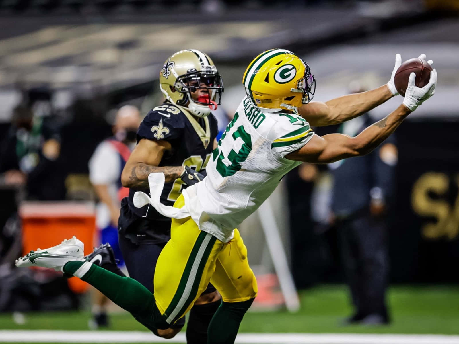 Allen Lazard Catching Football Against Defender Wallpaper