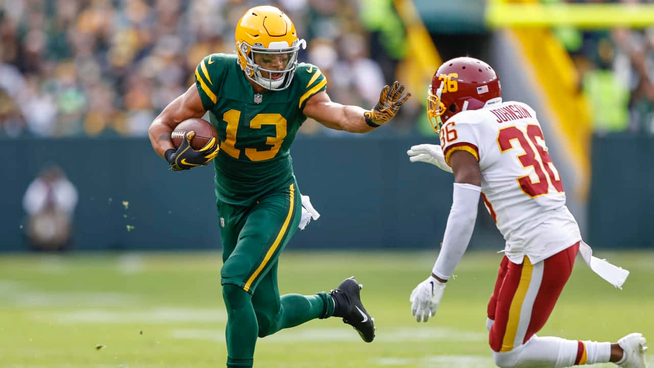 Allen Lazard Evading Tackle During Game Wallpaper