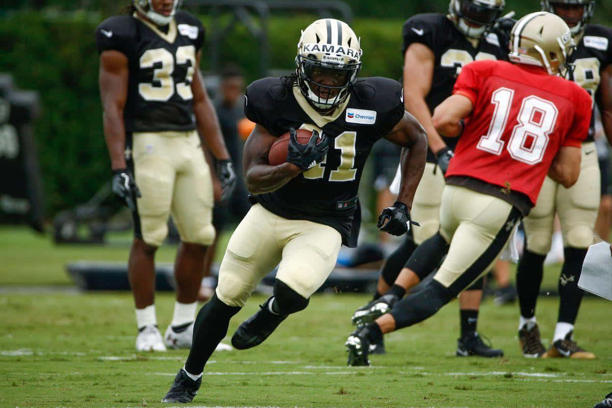 Alvin Kamara #41 Of The New Orleans Saints In Action On The Field Wallpaper