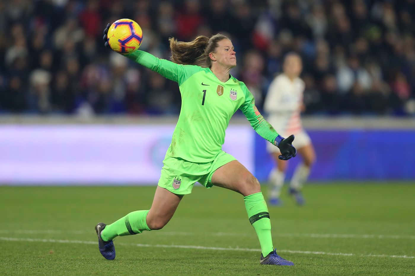 Alyssa Naeher In Action On The Soccer Field Wallpaper