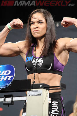 Amanda Nunes Flex On Stage Wallpaper