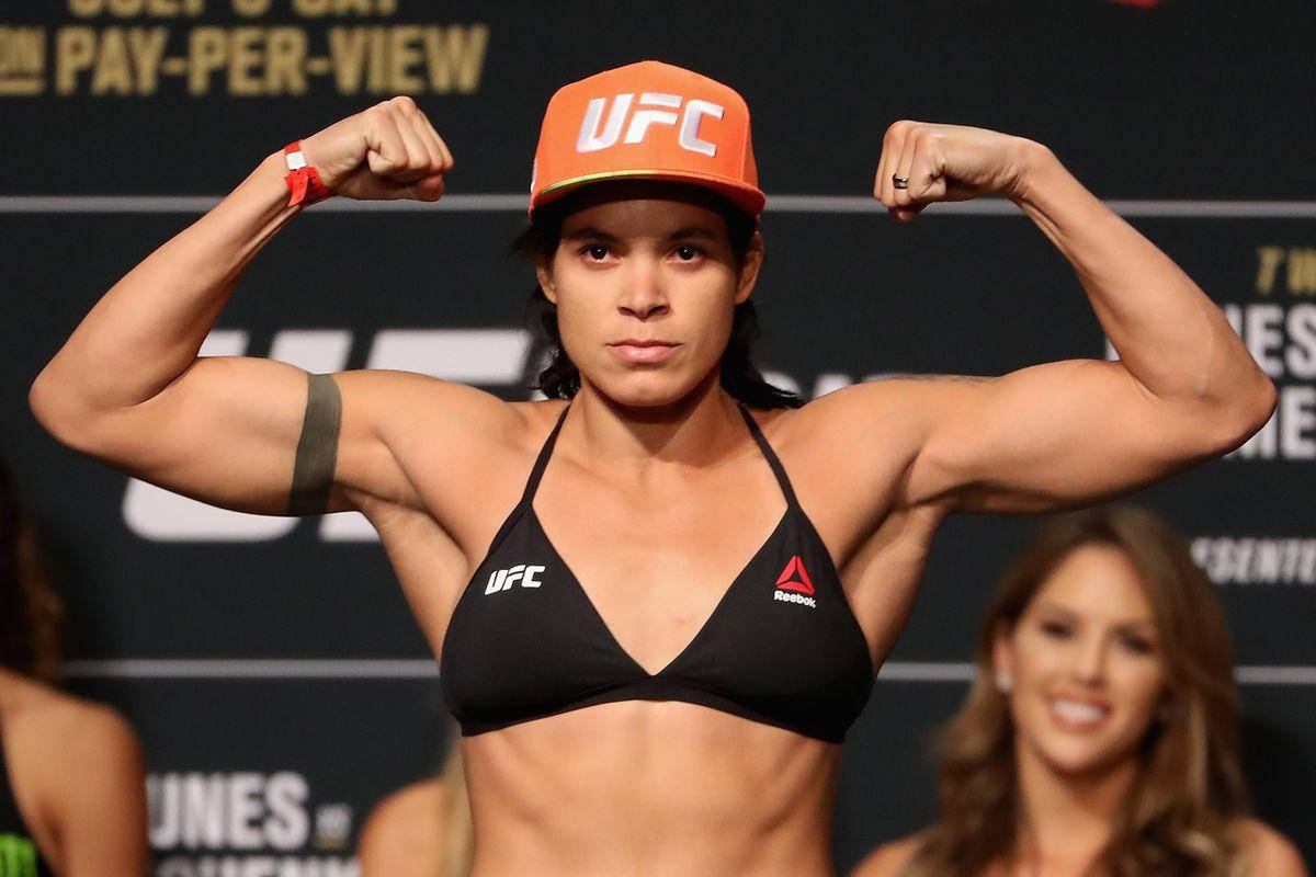 Amanda Nunes Flexing Muscles Wallpaper