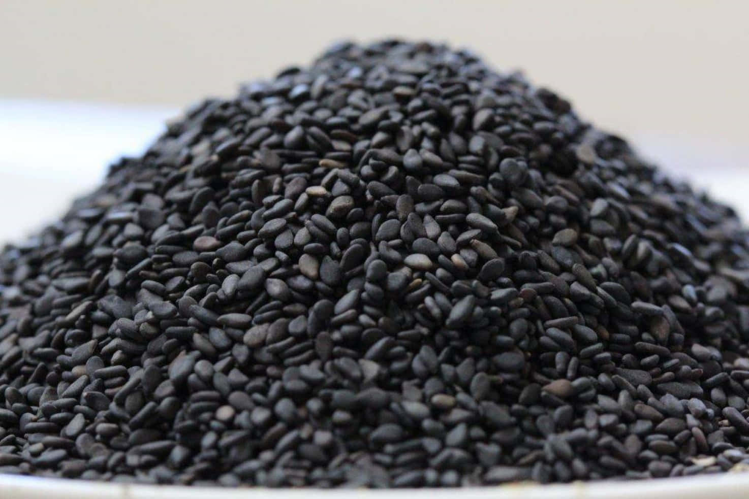 Amazing Bowl Of Nutritious Black Sesame Seeds Wallpaper