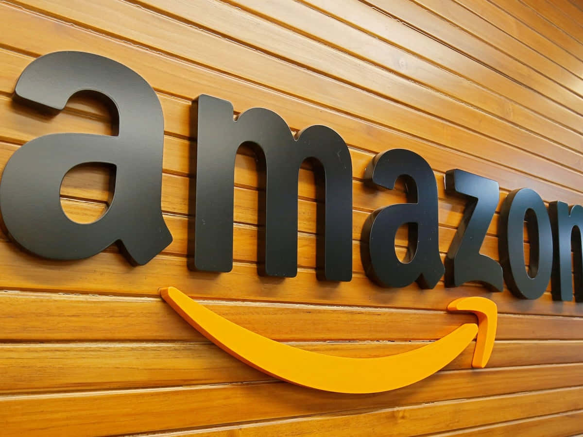 Amazon Uk Logo On Wooden Wall Wallpaper