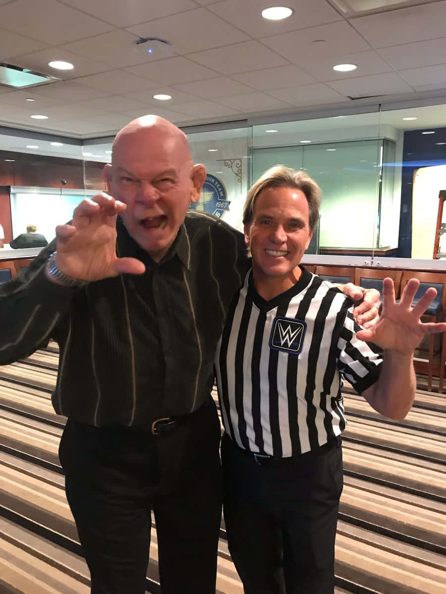 American Retired Wrestler Baron Von Raschke And Wwe Referee Wallpaper