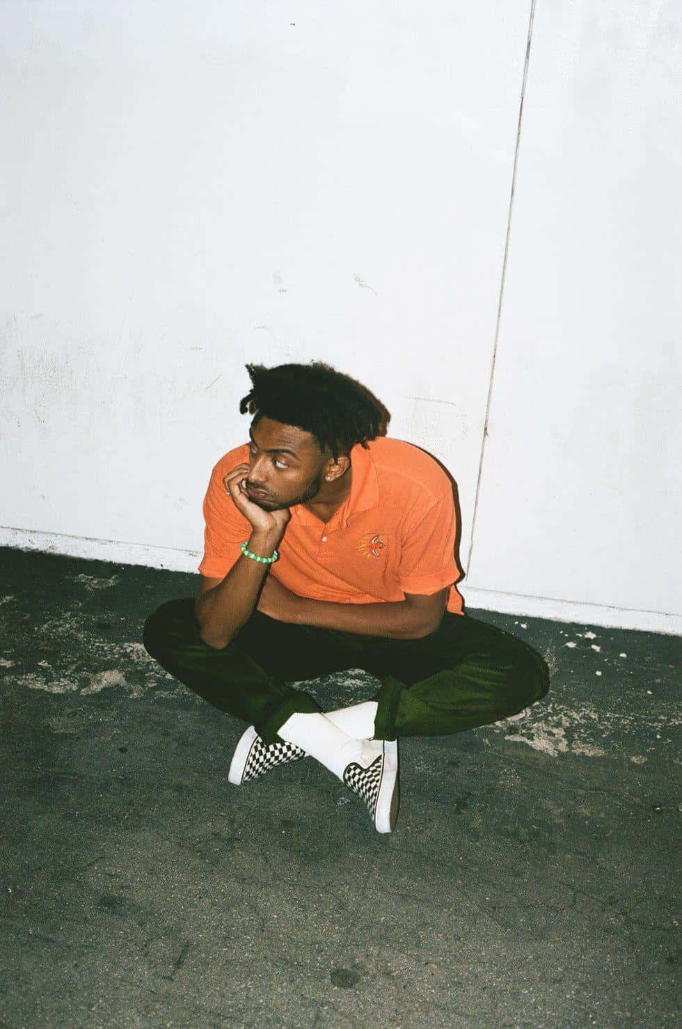 Amine Rapper Pfp Sitting On Ground Wallpaper