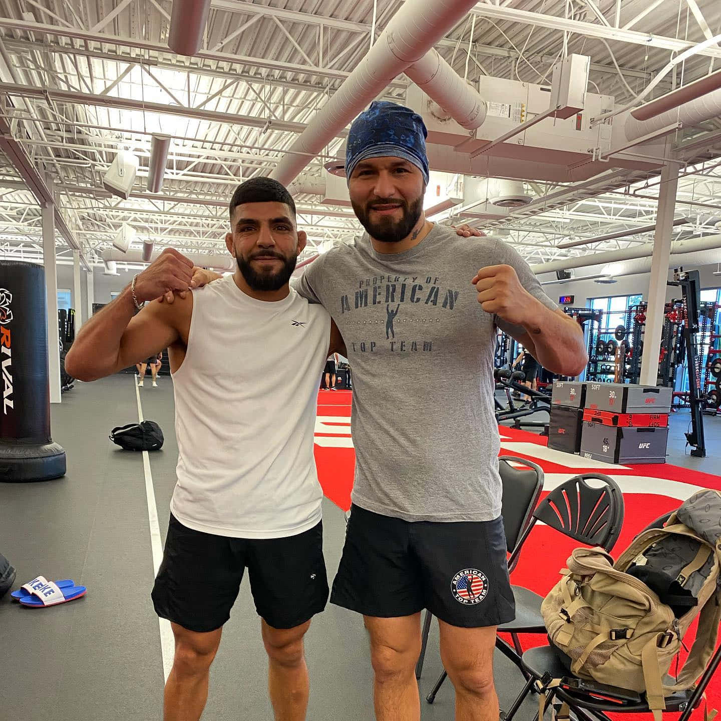 Amir Albazi In Gym With Fighter Wallpaper