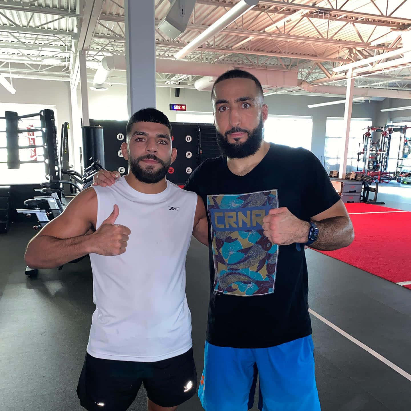 Amir Albazi Posing With Fellow Fighter Wallpaper