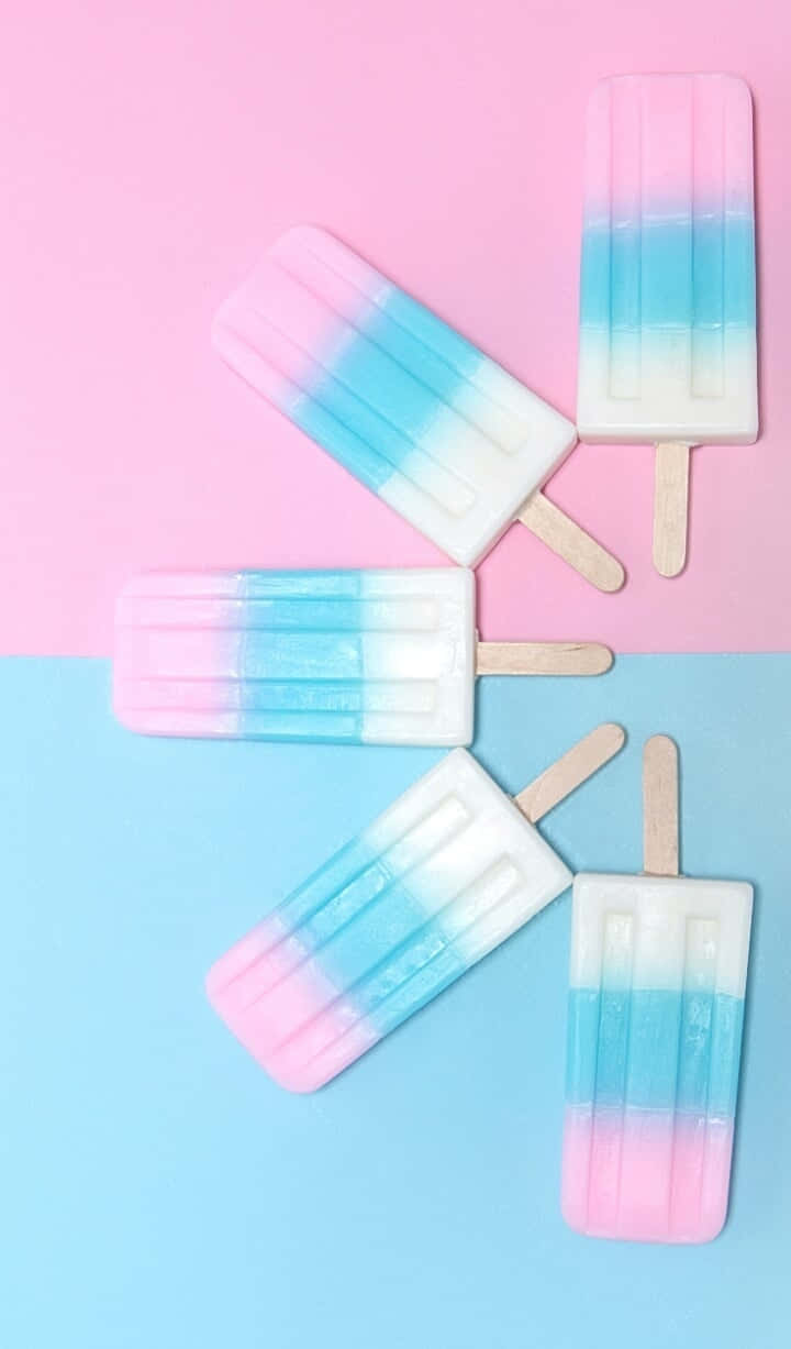 An Abstract Background Of Pastel Blue And Pink Hues Wallpaper