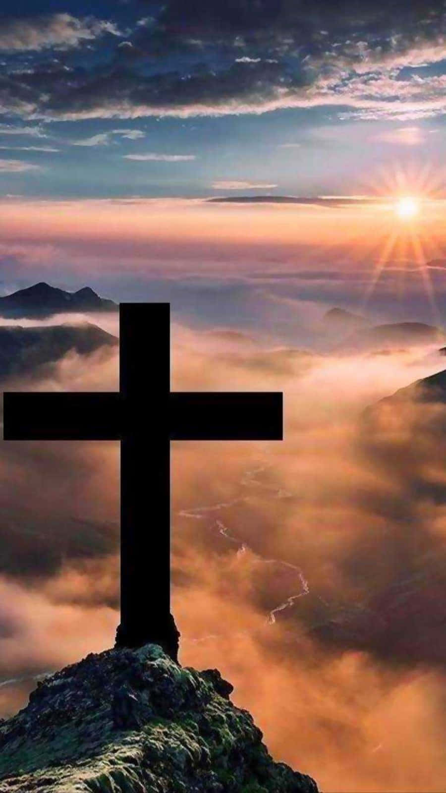 An Awe-inspiring Sunset Silhouette Of A Beautiful Cross. Wallpaper