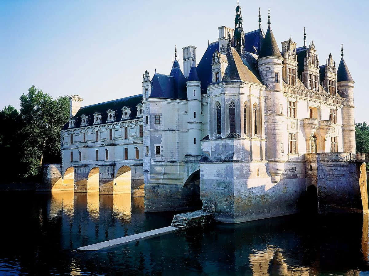 An Enchanting Afternoon View Of Chateau De Chenonceau Wallpaper