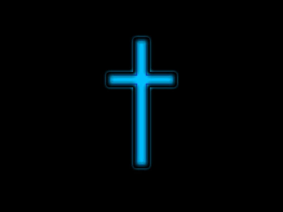 An Illuminated Cross Illuminated In Neon Colors Wallpaper