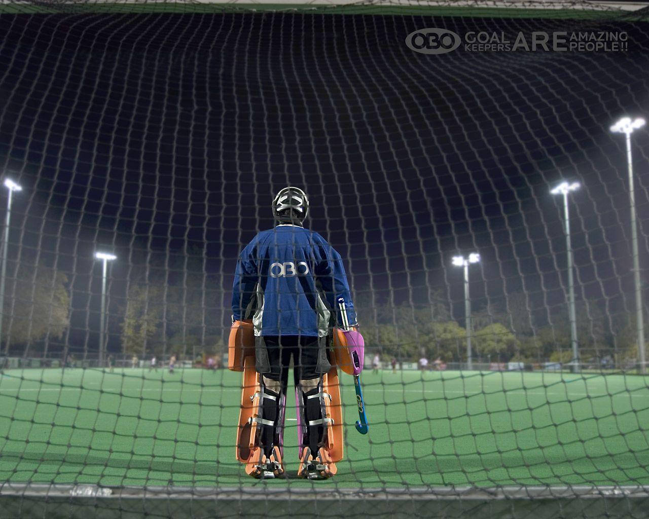 An Intense Moment In Field Hockey Wallpaper