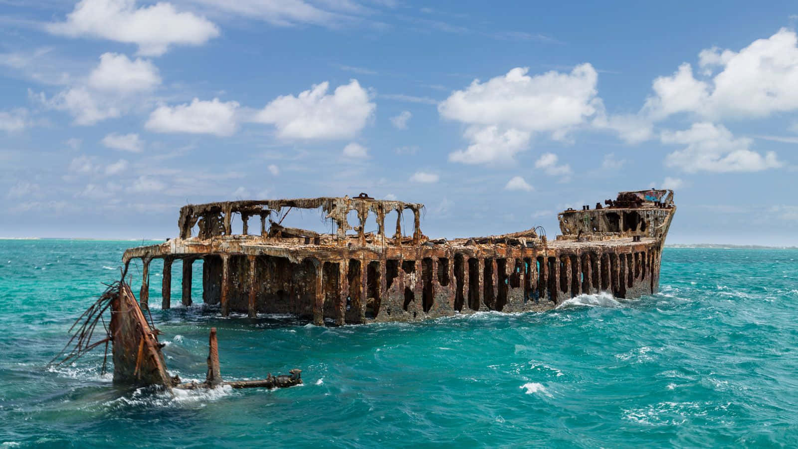 An Majestic Shipwreck Submerged In The Sea's Depths Wallpaper