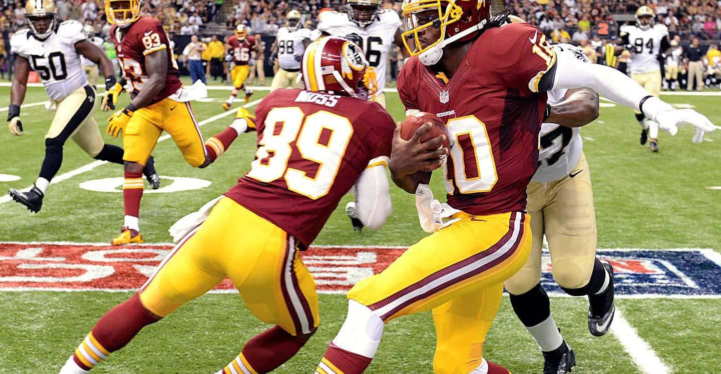 An Nfl Quarterback Readying For A Powerful Throw Wallpaper