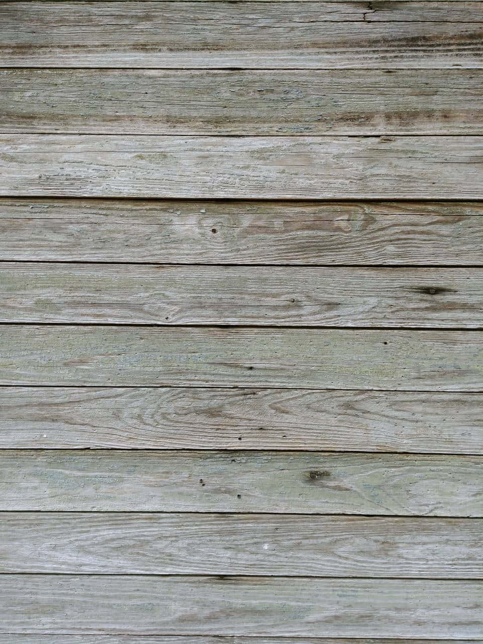 An Old Barn Boarded Up With Wooden Planks. Wallpaper