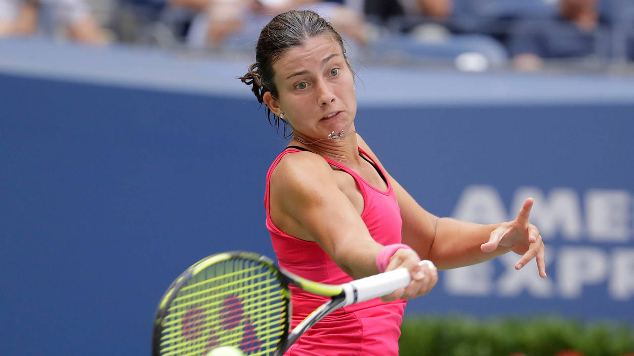 Anastasija Sevastova Dressed In A Pink Sports Top Wallpaper