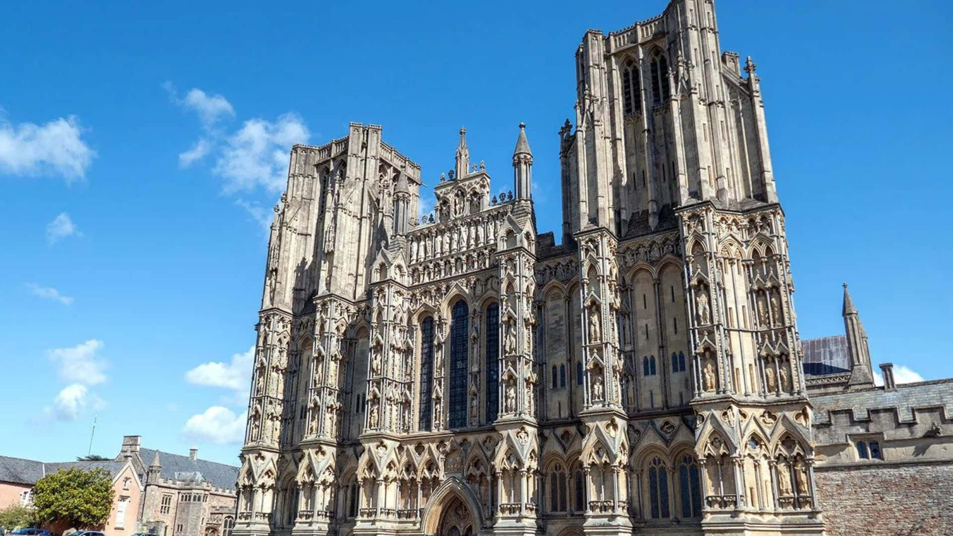 Ancient Wells Cathedral Against The Vibrant Sky In Wells, Uk Wallpaper