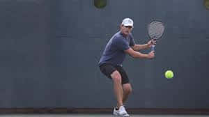 Andy Roddick Looking Down At Ball Wallpaper