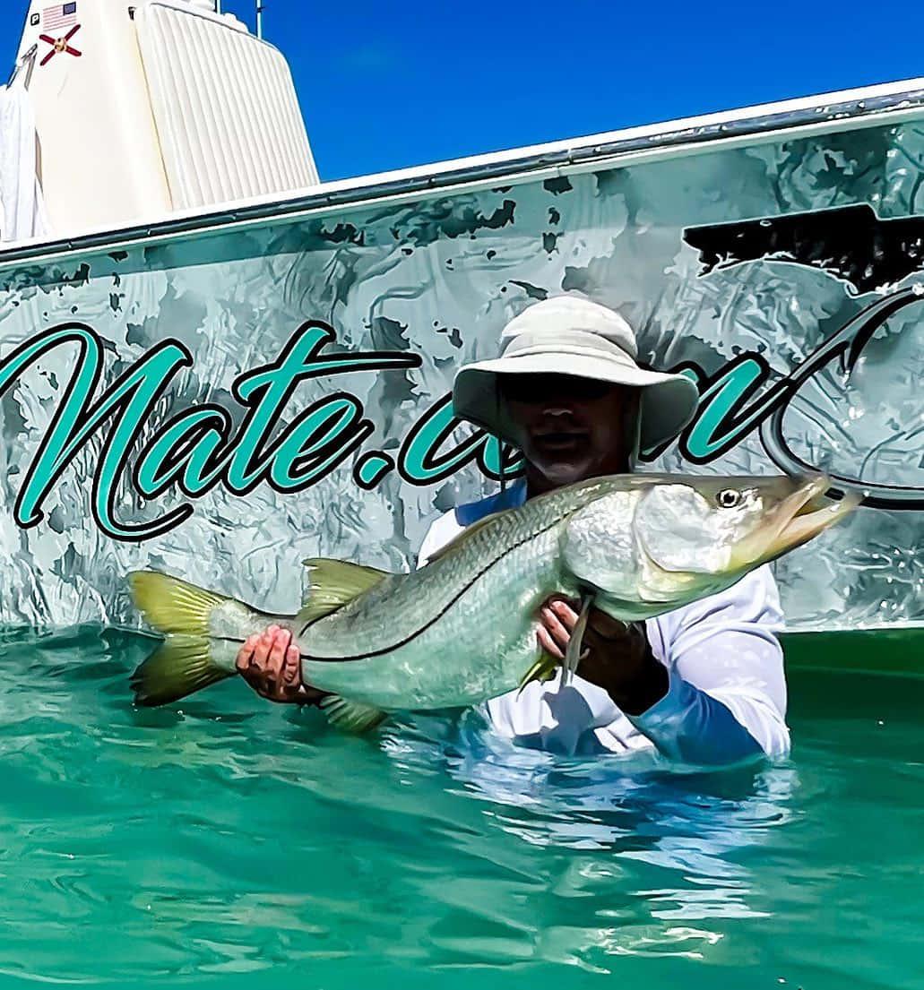 Anglerwith Caught Tarpon Wallpaper