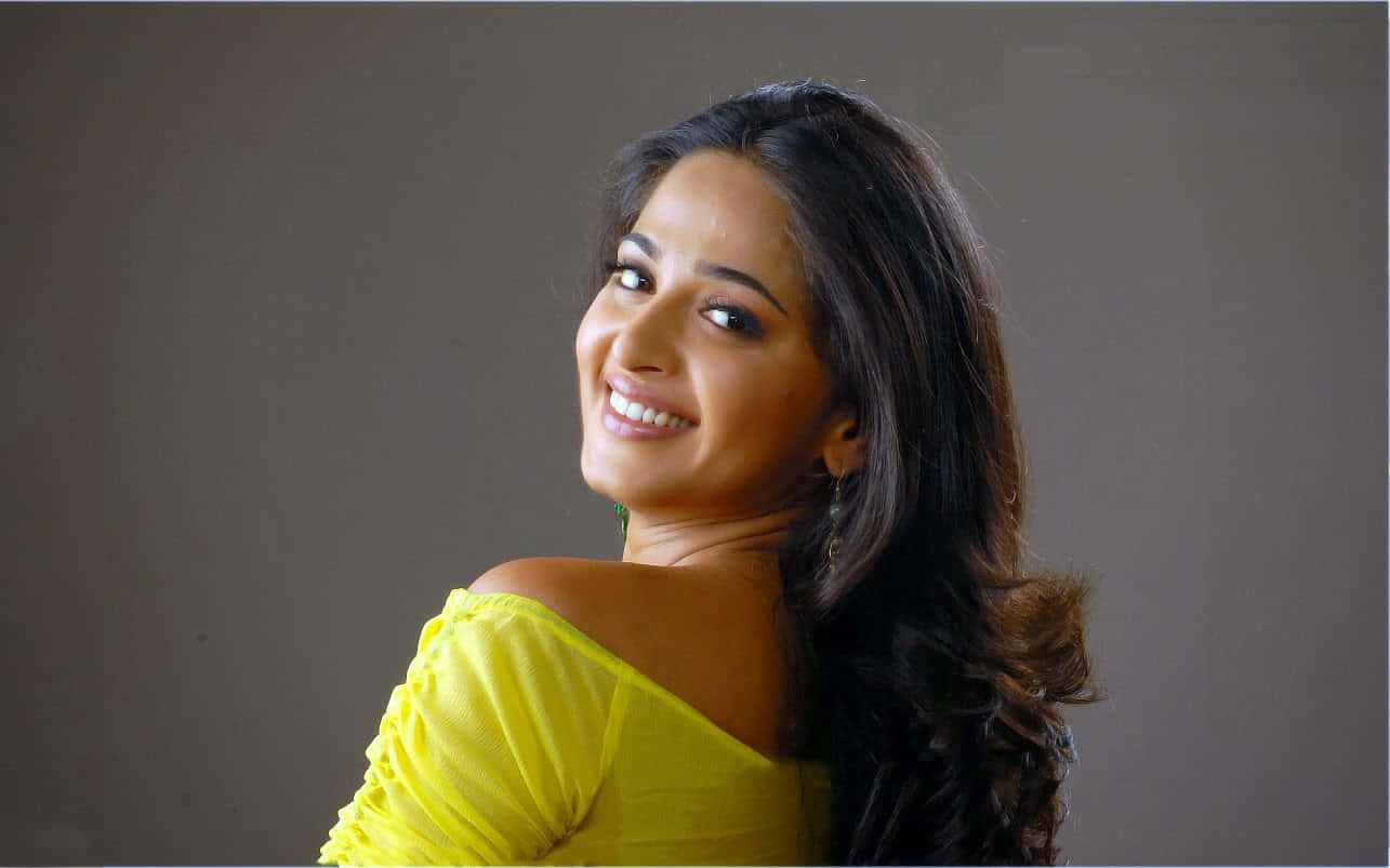 Anushka Shetty Yellow Top Glamorous Look Wallpaper