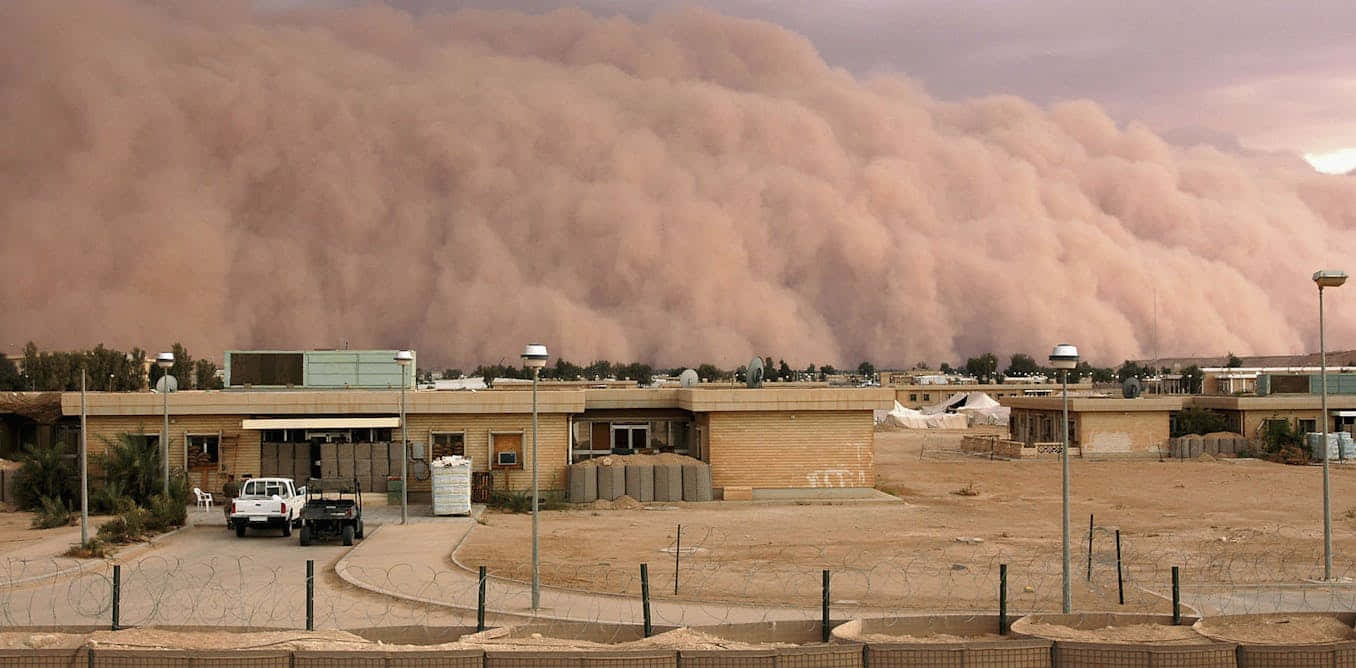 Approaching_ Dust_ Storm_ Over_ Buildings.jpg Wallpaper