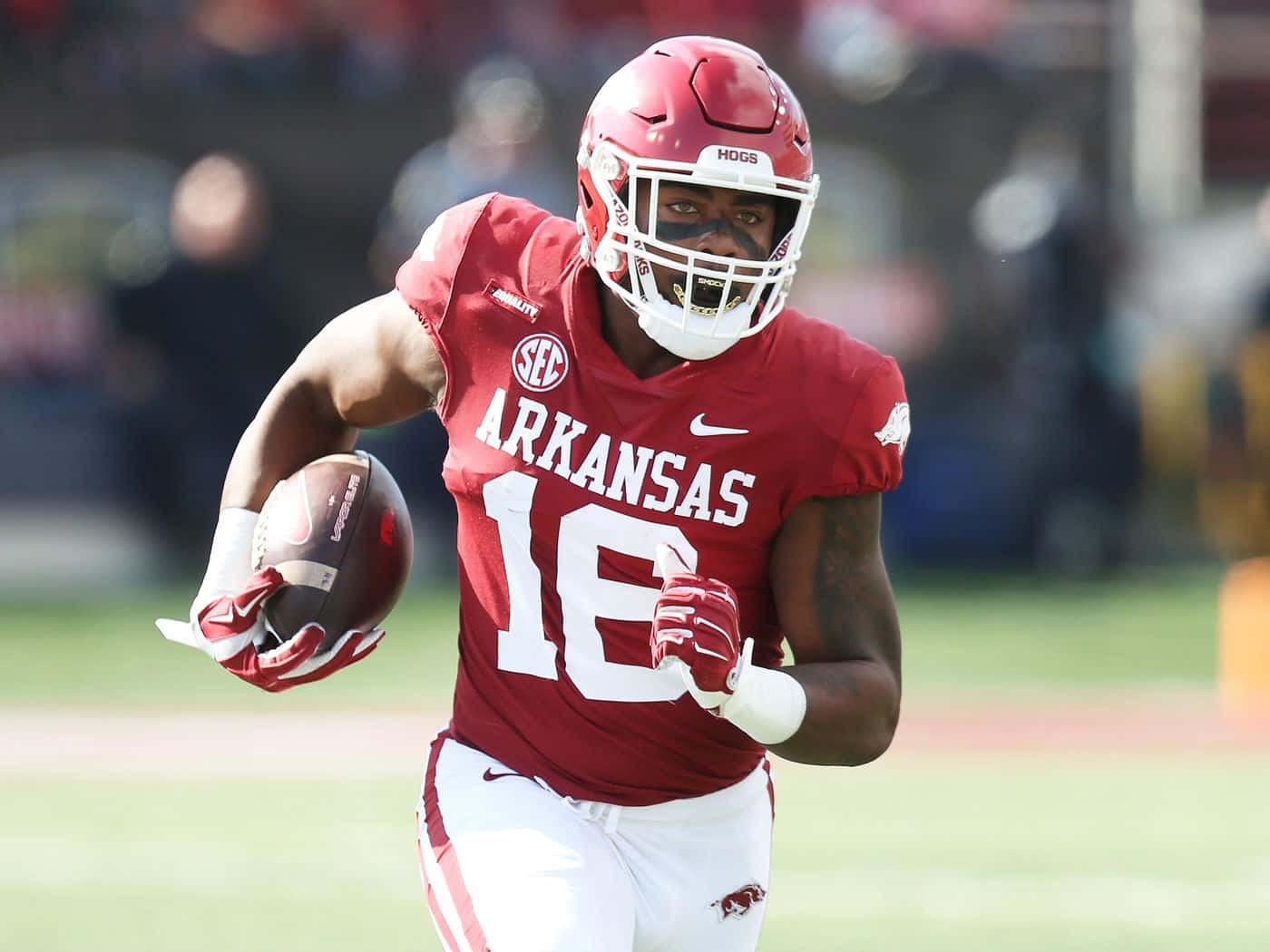 Arkansas Football Player Running With Ball Wallpaper